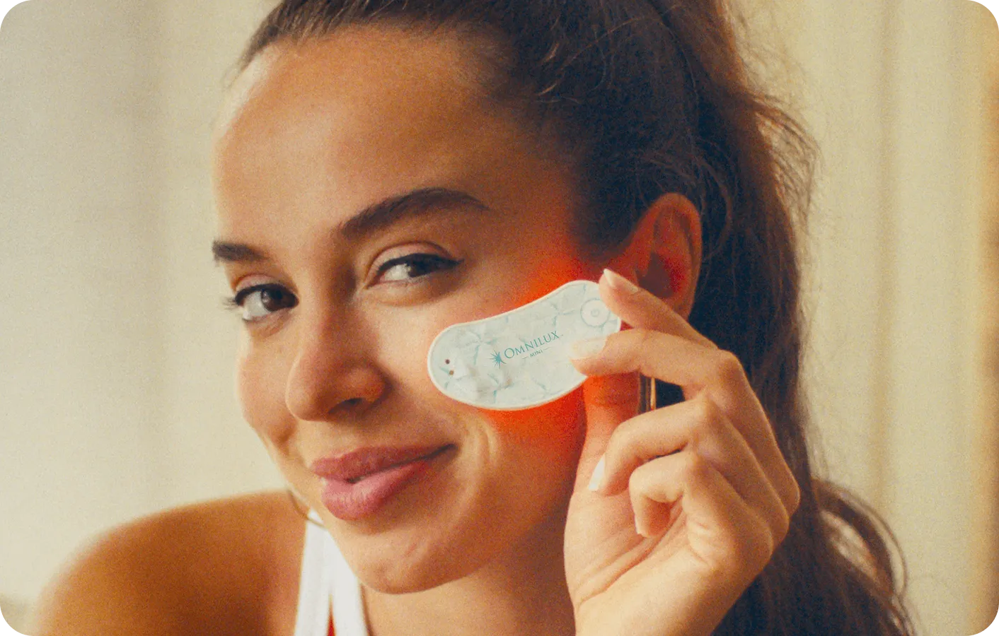Woman using Omnilux Eye Brightener