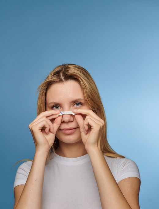 Place the strip across the bridge of your nose