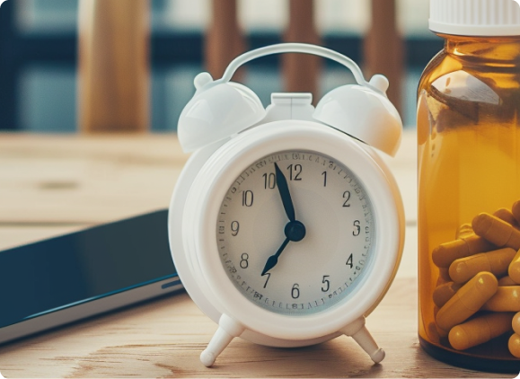 Person whisking a beverage in a kitchen near a knife block and packaged goods.