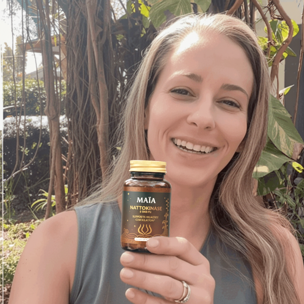 Person holding a Maia ceremonial cacao package outdoors.