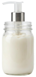 A jar filled with orange capsules.