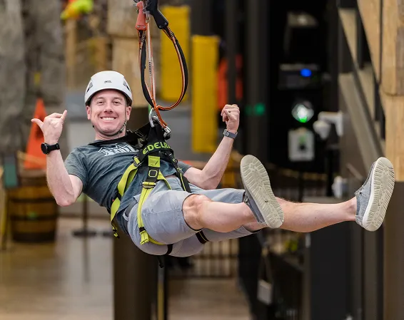 Visitor on the zipline at Bolder Adventure Park