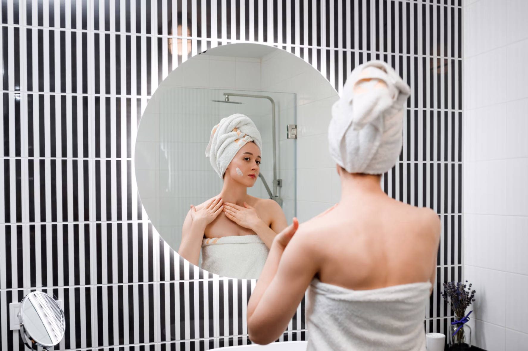 Nancy applying serum to her face with a hopeful expression