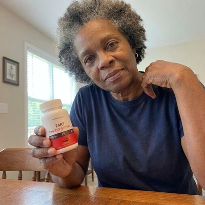 Isabella holding a cup of hibiscus tea