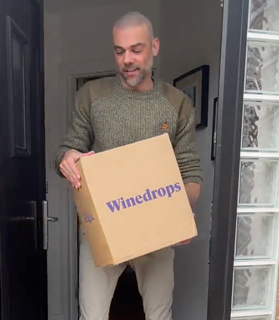 People enjoying a glass of rosé wine together.