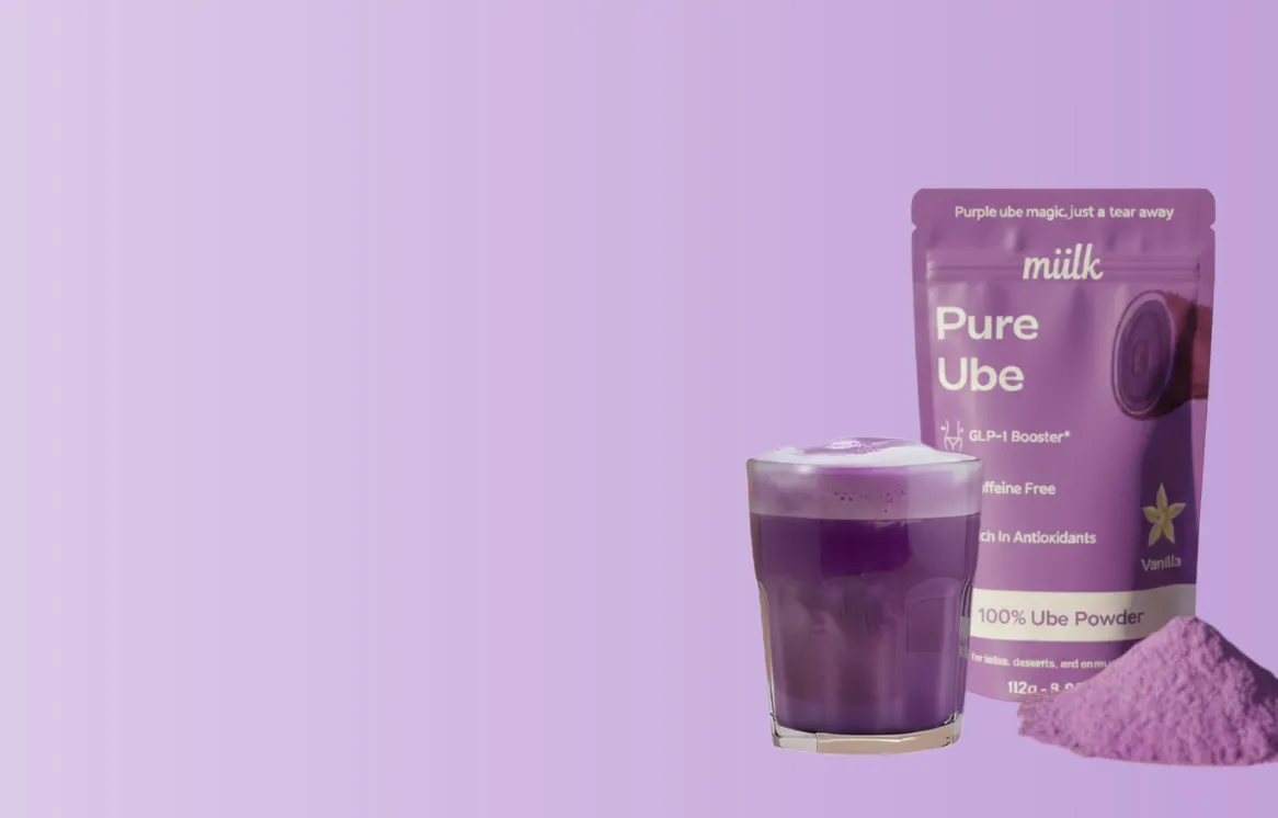 White mug with chocolate chunks, next to a decorative cacao package.