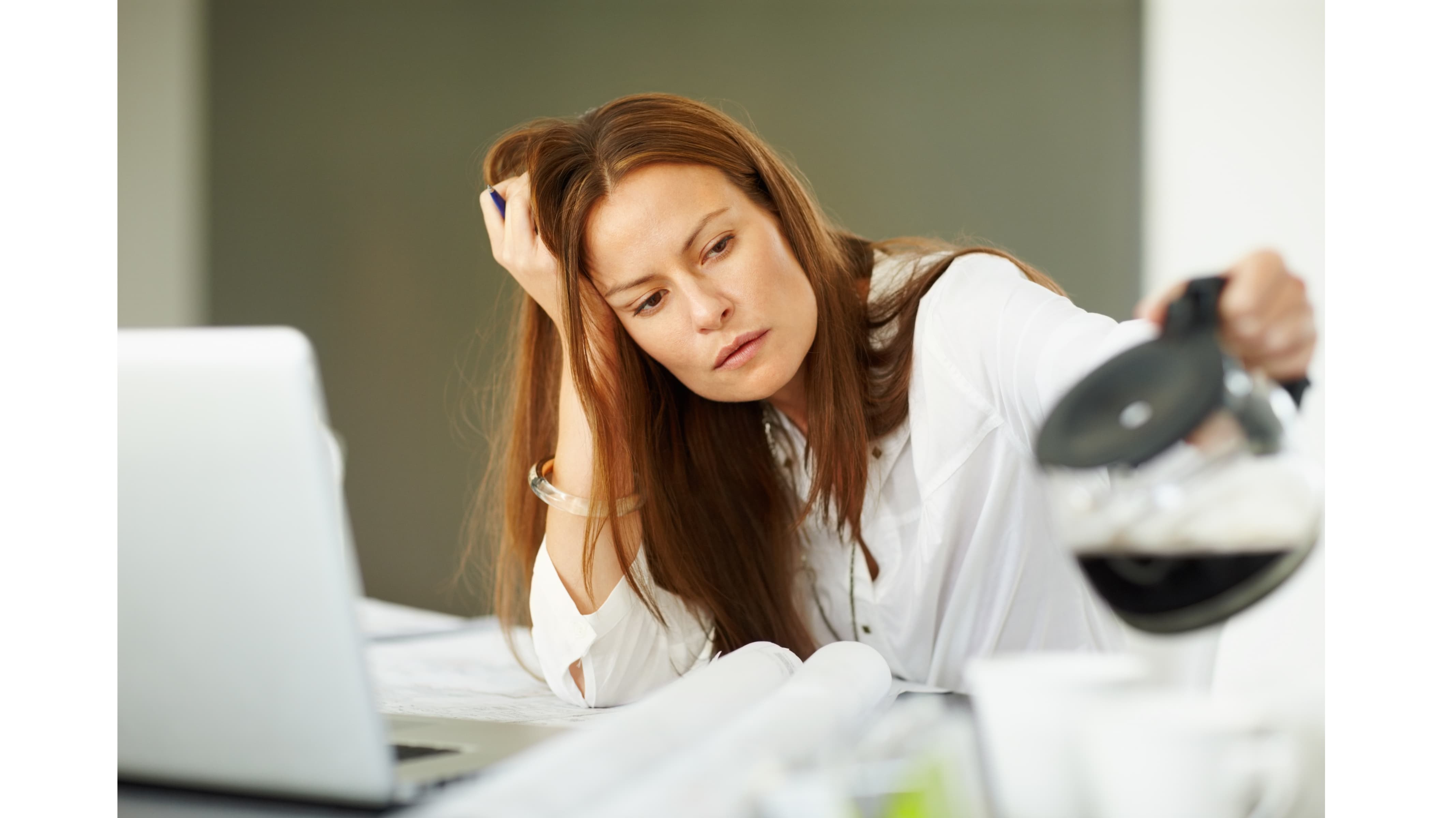 Woman using a foam roller for back exercises in a gym.