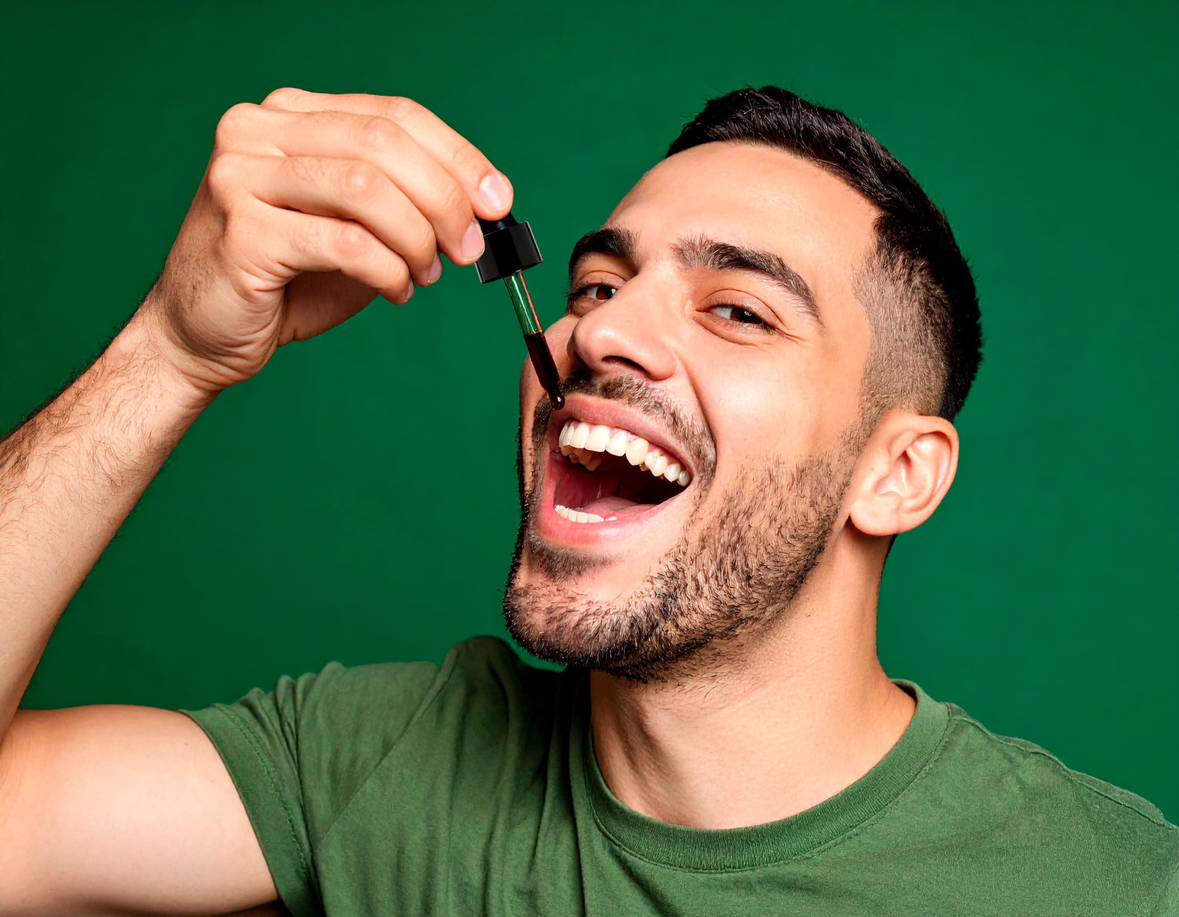 Person holding a container of orange creatine monohydrate gummies in a room.