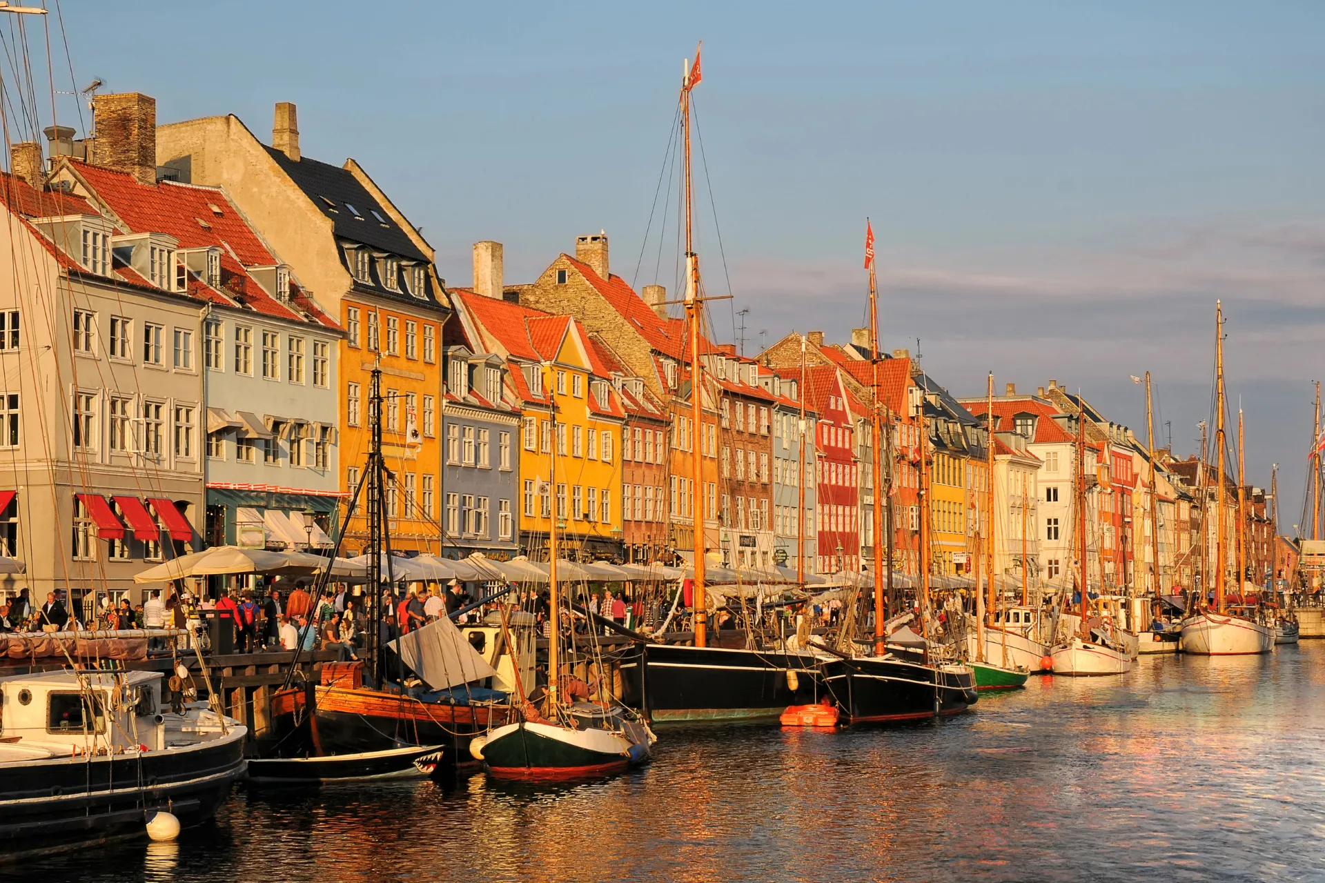 The colourful Nyhavn harbour townhouses at sunset in Copenhagen, Denmark